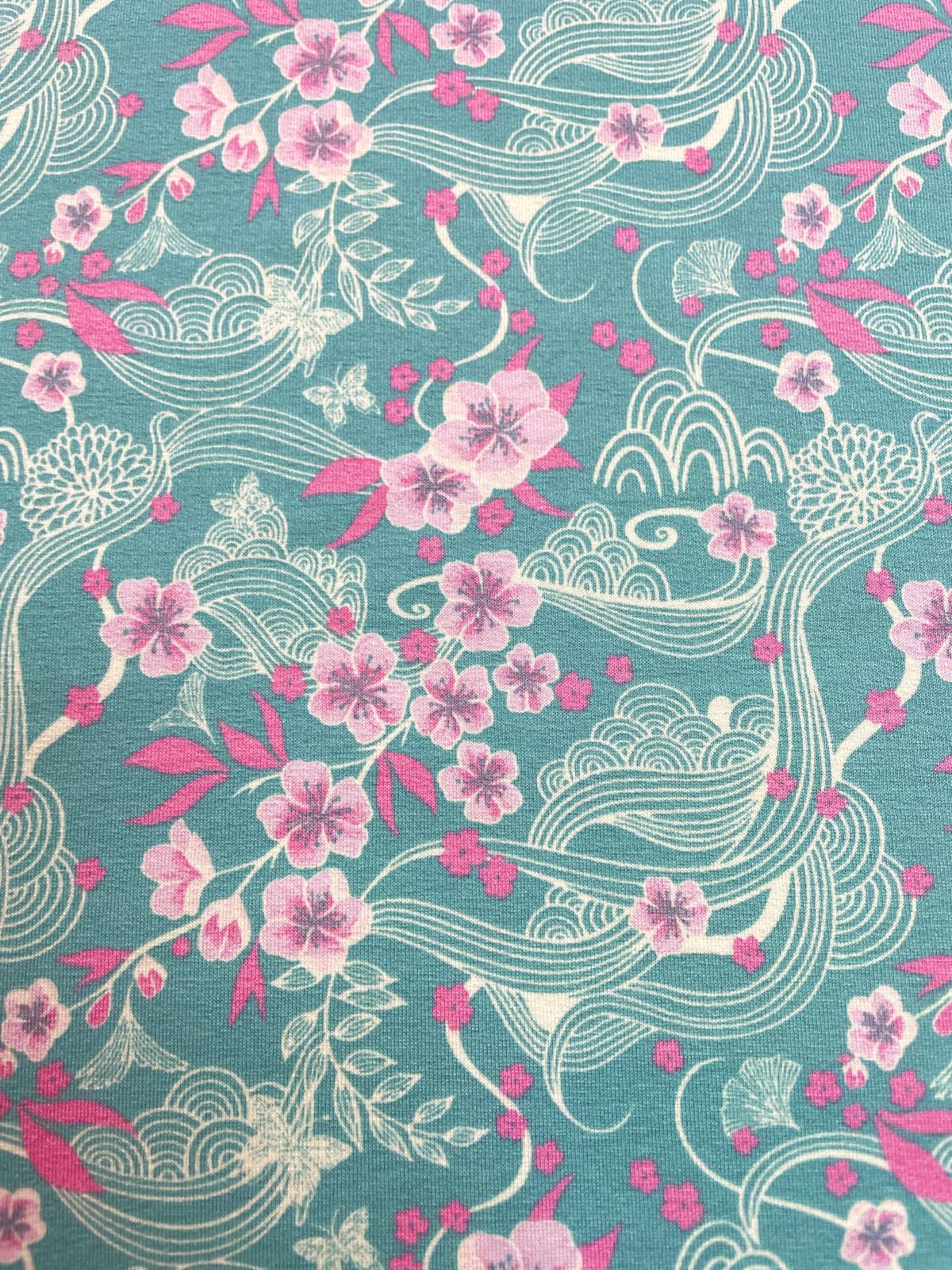 Viskose Jersey "Sakura Wave" petrol / grün mit rosa Blümchen